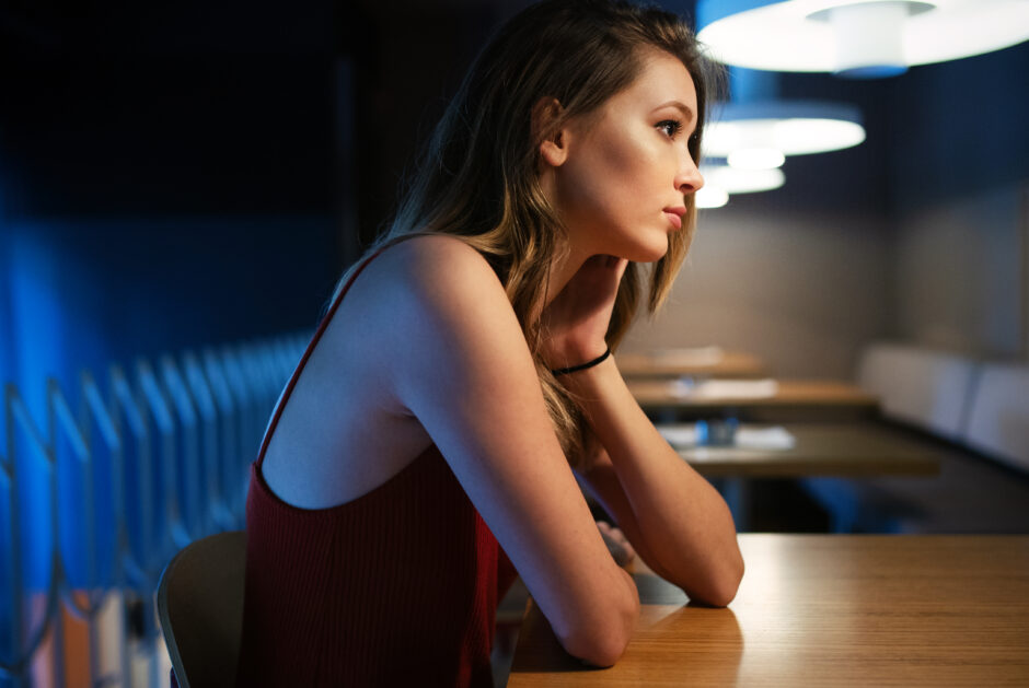 Portrait of clever young woman thinking alone