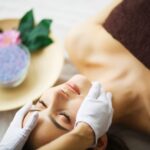 Beauty and Care. Young Woman Relax in Spa Salon. Skin Care Face.