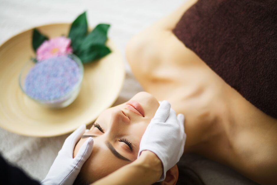 Beauty and Care. Young Woman Relax in Spa Salon. Skin Care Face.