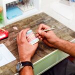 Dentist preparing artificial teeth with a special tool