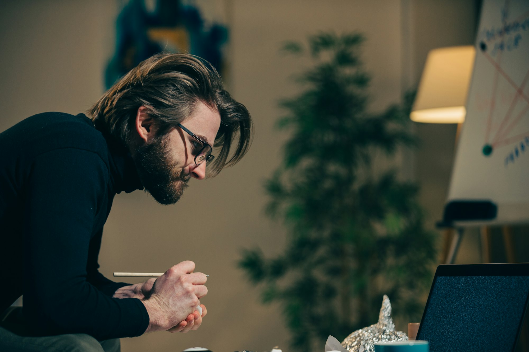 A paranoid makes notes or calculations on sheets in search of answers to pseudoscientific statements